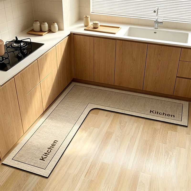 💧 Stop slipping on wet kitchen floors — this L-shaped mat absorbs water and oil fast, stays put, and cushions your feet while you cook. 🏠